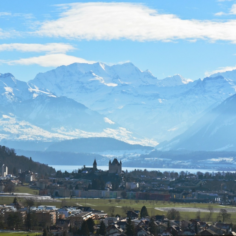 a city in front of mountains